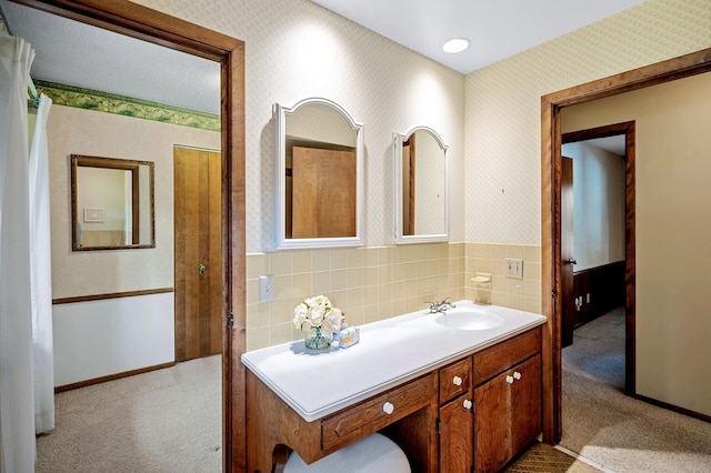 451 Reflection Rd, Apple Valley, MN 55124 - bathroom with vanity and wallpapered walls