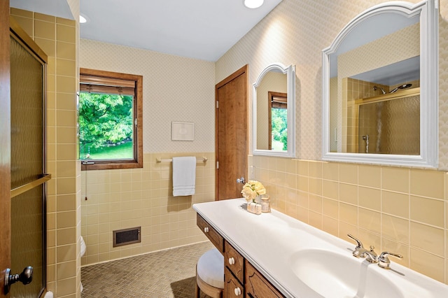 451 Reflection Rd, Apple Valley, MN 55124 - full bathroom with tile walls, an enclosed shower, vanity, wallpapered walls, and tile patterned floors