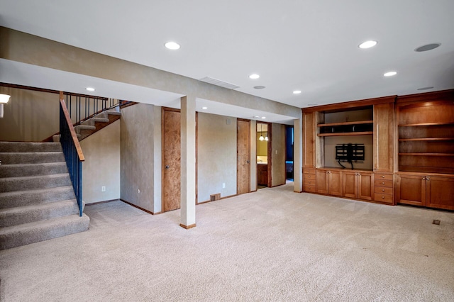 451 Reflection Rd, Apple Valley, MN 55124 - unfurnished living room with light colored carpet, stairs, and recessed lighting