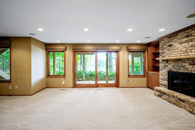 451 Reflection Rd, Apple Valley, MN 55124 - unfurnished living room with recessed lighting, carpet flooring, a fireplace, and built in shelves