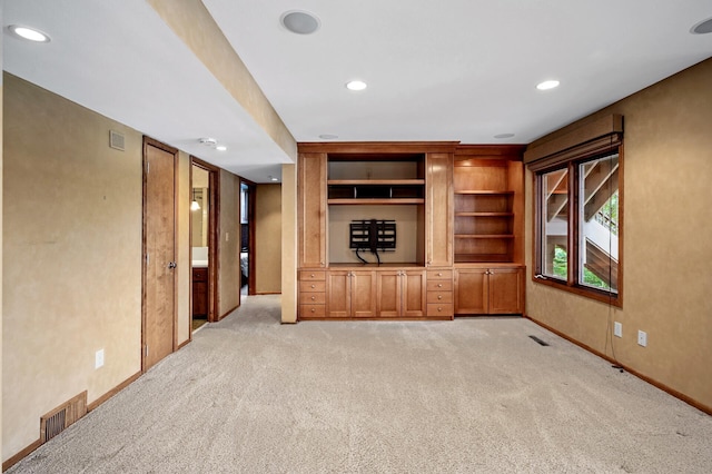 451 Reflection Rd, Apple Valley, MN 55124 - unfurnished living room with light colored carpet, recessed lighting, and built in shelves