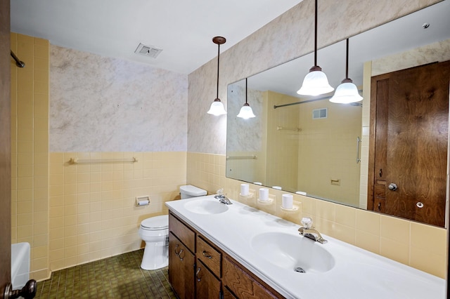 451 Reflection Rd, Apple Valley, MN 55124 - bathroom featuring tile walls and double vanity