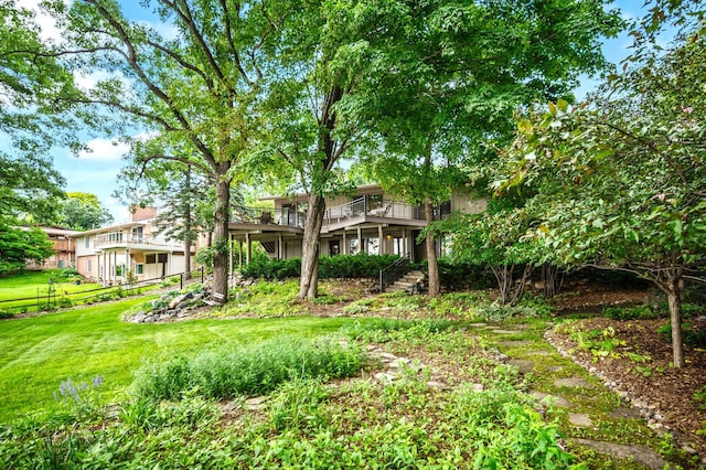 451 Reflection Rd, Apple Valley, MN 55124 - view of grassy yard with a wooden deck
