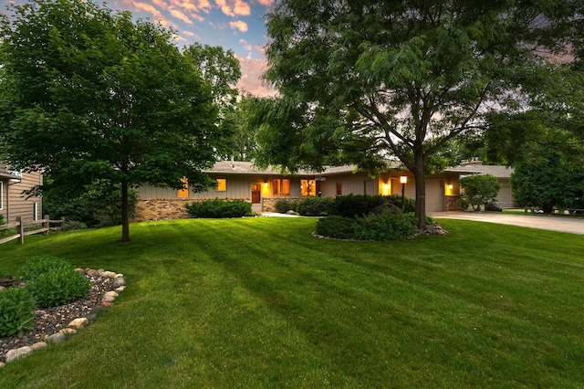 451 Reflection Rd, Apple Valley, MN 55124 - ranch-style house with concrete driveway, an attached garage, board and batten siding, and stone siding