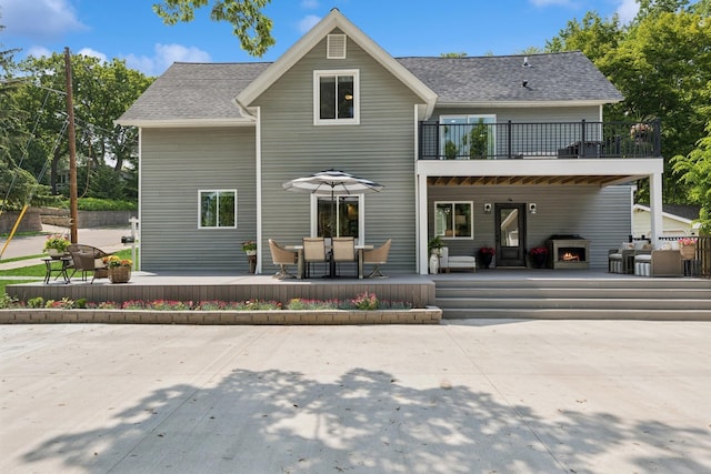 406 Mulberry St W, Stillwater, MN 55082 - rear view of property with a balcony, a patio, and roof with shingles