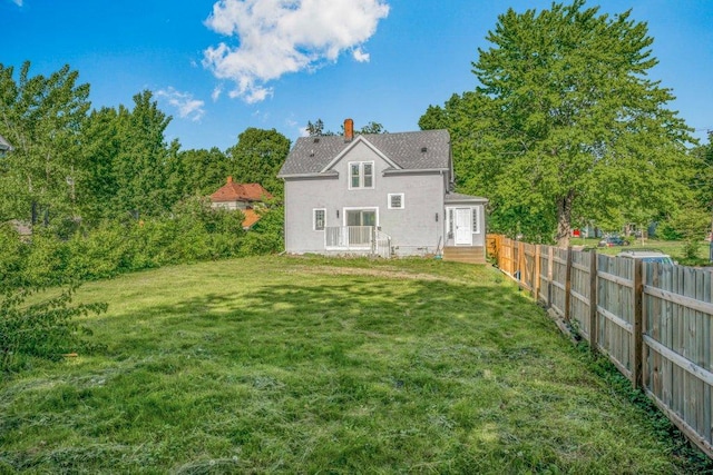 1912 15th Ave N, Minneapolis, MN 55411 - rear view of house featuring stucco siding and a chimney