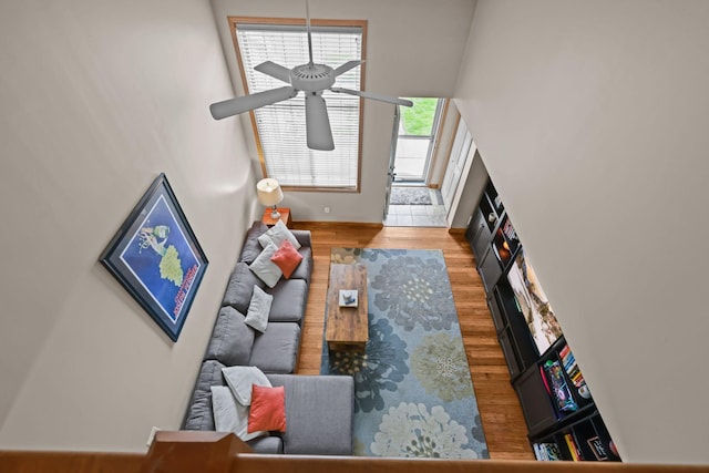 367 Ojibway Path, Lino Lakes, MN 55014 - living room featuring ceiling fan, wood finished floors, baseboards, and a towering ceiling