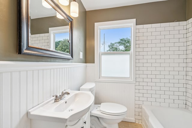 3945 15th Ave S, Minneapolis, MN 55407 - bathroom with toilet, a wainscoted wall, plenty of natural light, and vanity