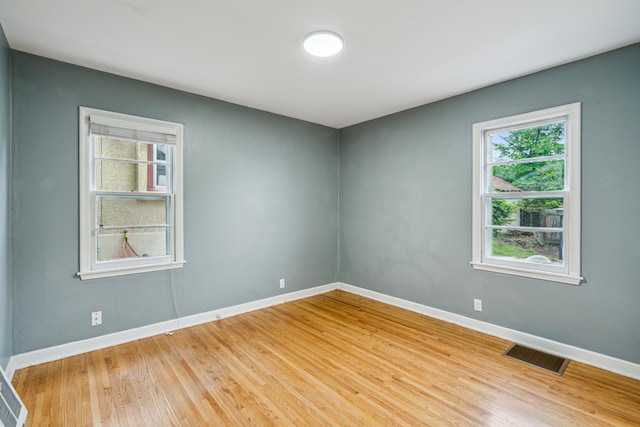 3945 15th Ave S, Minneapolis, MN 55407 - empty room featuring light wood-style flooring and baseboards