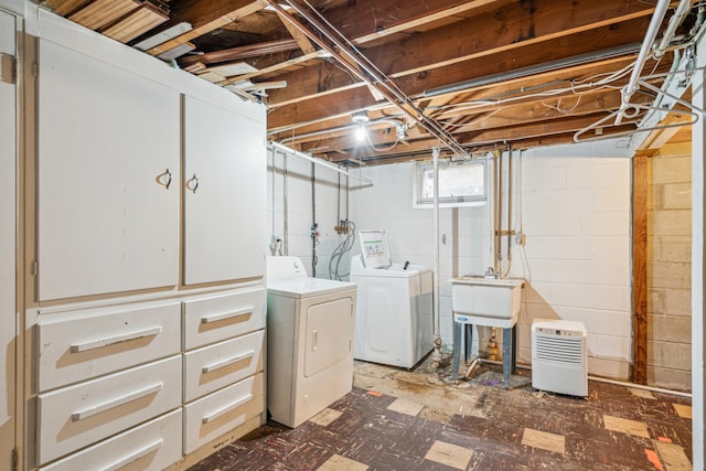 3945 15th Ave S, Minneapolis, MN 55407 - laundry area with washer and clothes dryer and tile patterned floors