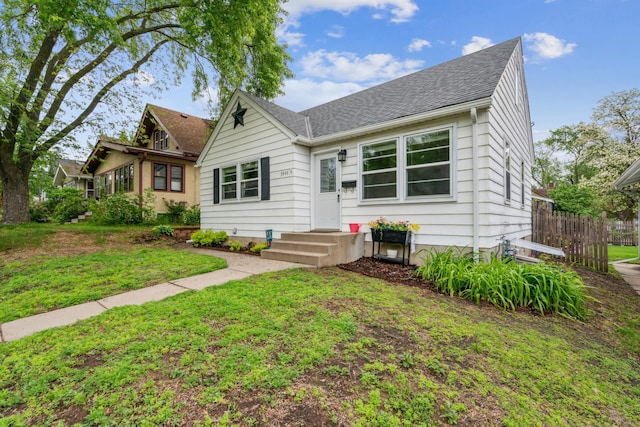 3945 15th Ave S, Minneapolis, MN 55407 - view of front facade featuring a shingled roof