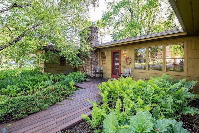 1209 5th St N, Fargo, ND 58102 - property entrance with a chimney and a wooden deck