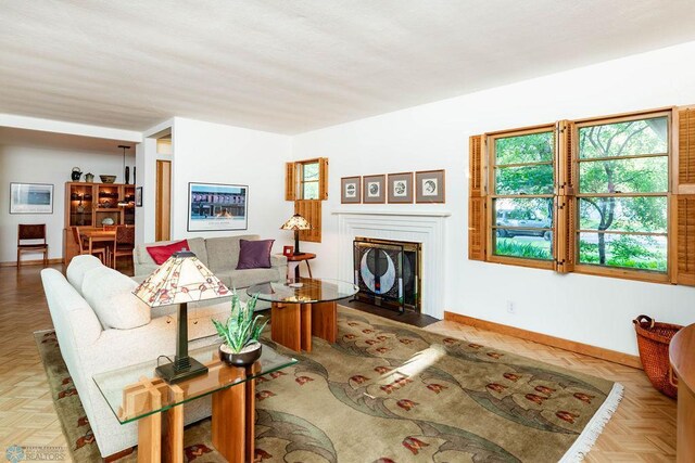 1209 5th St N, Fargo, ND 58102 - living area featuring baseboards and a fireplace with flush hearth