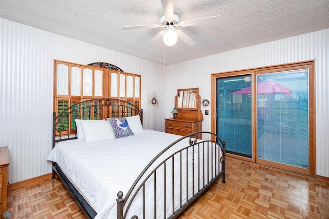 1209 5th St N, Fargo, ND 58102 - bedroom with a textured ceiling, access to outside, a ceiling fan, and baseboards