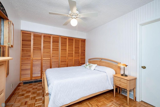 1209 5th St N, Fargo, ND 58102 - bedroom with a textured ceiling, a closet, ceiling fan, and baseboards