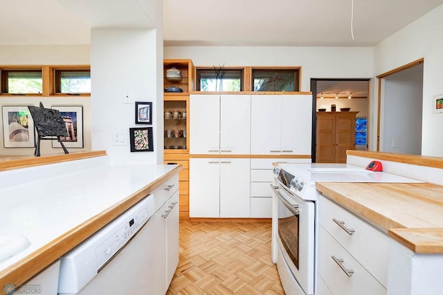 1209 5th St N, Fargo, ND 58102 - kitchen featuring white appliances, white cabinetry, and open shelves