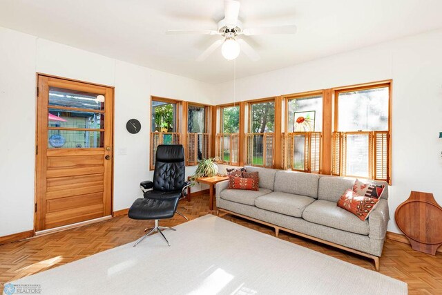 1209 5th St N, Fargo, ND 58102 - living room featuring baseboards and ceiling fan