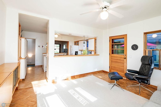 1209 5th St N, Fargo, ND 58102 - living area with baseboards and a ceiling fan