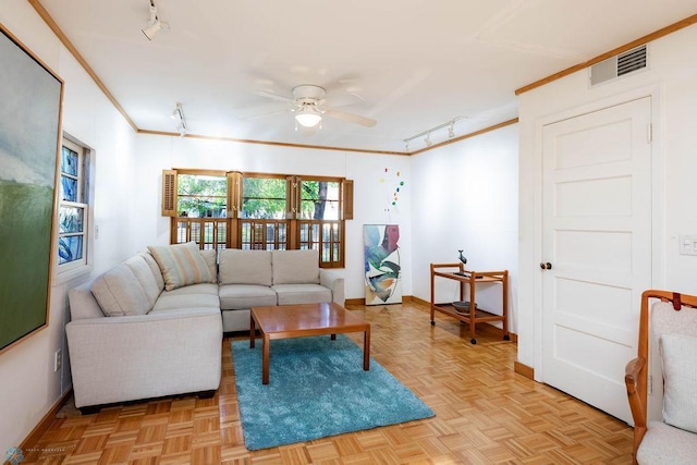 1209 5th St N, Fargo, ND 58102 - living area featuring track lighting, a ceiling fan, crown molding, and baseboards