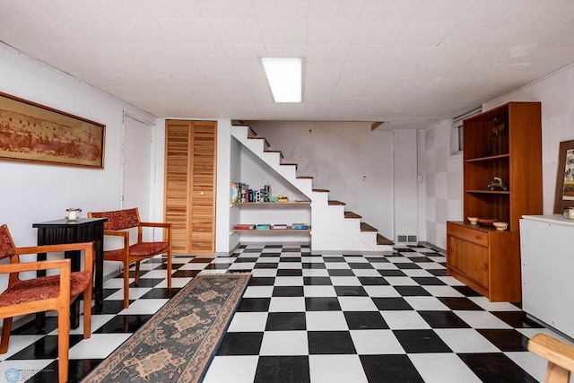 1209 5th St N, Fargo, ND 58102 - finished below grade area featuring dark floors and stairway