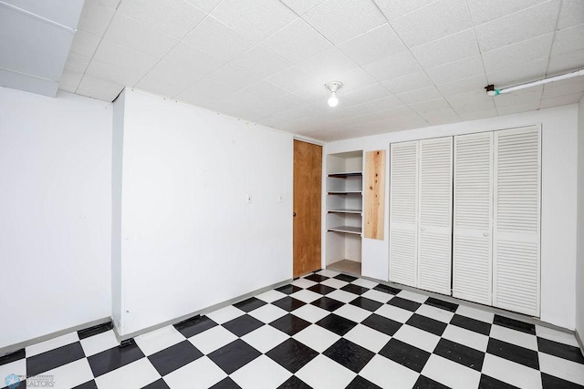 1209 5th St N, Fargo, ND 58102 - finished below grade area featuring tile patterned floors and a paneled ceiling