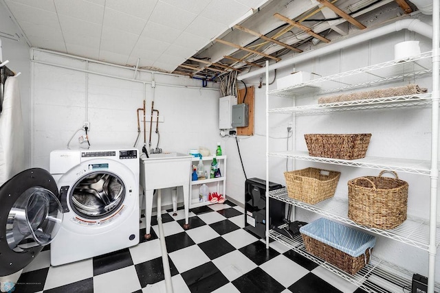 1209 5th St N, Fargo, ND 58102 - laundry room featuring tile patterned floors, washer and clothes dryer, and electric panel