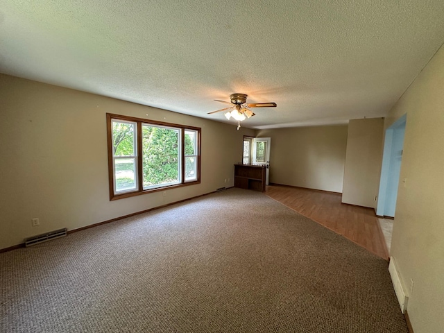 14390 Sperry Lake Rd, Harrison Twp, MN 56209 - carpeted empty room with a ceiling fan, a textured ceiling, and baseboards