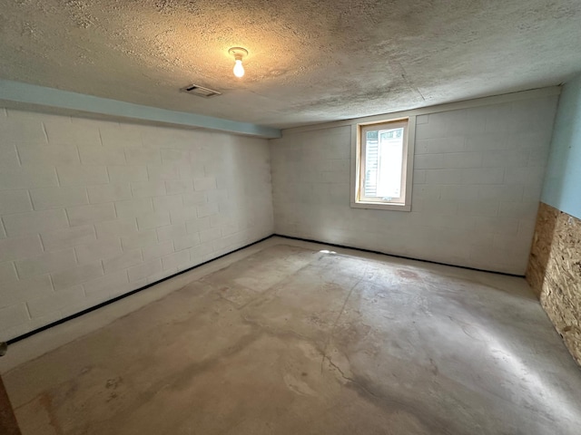 14390 Sperry Lake Rd, Harrison Twp, MN 56209 - basement with concrete block wall and a textured ceiling