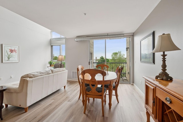 1829 3rd Ave S Unit 212, Minneapolis, MN 55404 - dining area featuring light wood-style floors and baseboards