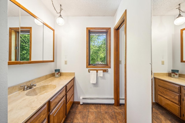 12975 185th St, Cold Spring, MN 56320 - bathroom with baseboard heating, a textured ceiling, plenty of natural light, and vanity