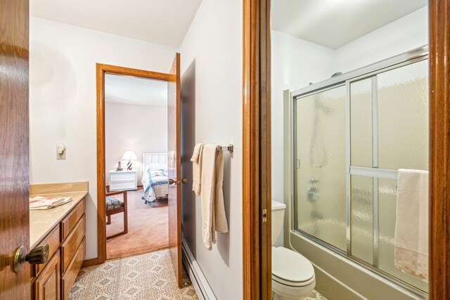 12975 185th St, Cold Spring, MN 56320 - full bathroom with connected bathroom, shower / bath combination with glass door, vanity, toilet, and baseboard heating