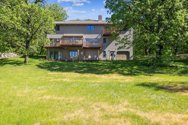12975 185th St, Cold Spring, MN 56320 - rear view of property with a chimney, a deck, a lawn, and an attached garage
