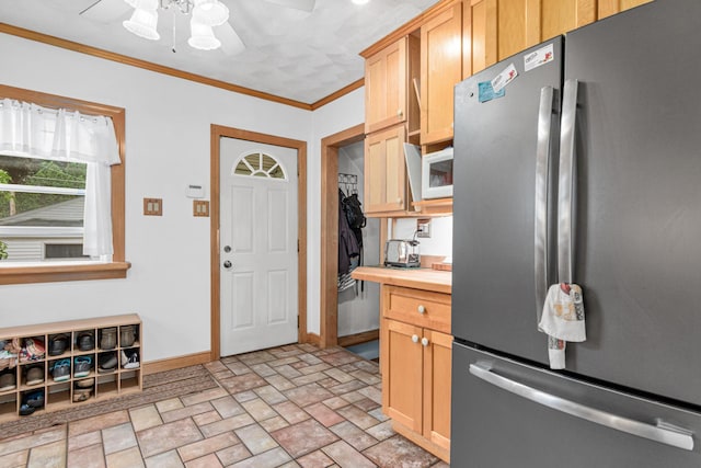 1344 Schletti St, Saint Paul, MN 55117 - kitchen featuring freestanding refrigerator, butcher block counters, ceiling fan, baseboards, and crown molding