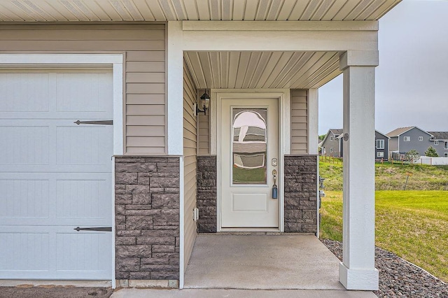 39685 Fallbrook Ave, North Branch, MN 55056 - doorway to property with stone siding and covered porch
