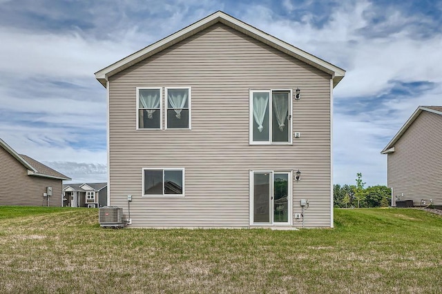 39685 Fallbrook Ave, North Branch, MN 55056 - back of house with a yard and central air condition unit