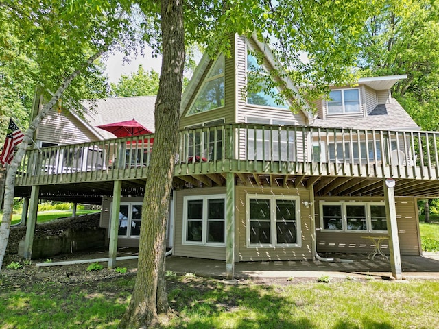 21550 62nd St NW, Lake Andrew Twp, MN 56289 - back of property featuring a wooden deck and a patio area
