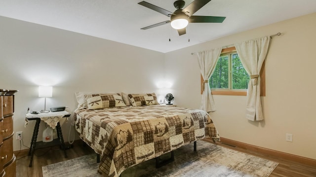 3015 Aspen Ter, Scott Twp, WI 54830 - bedroom with wood finished floors, baseboards, and a ceiling fan