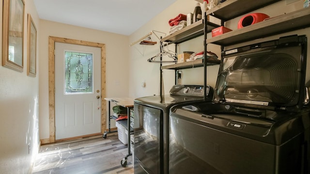 3015 Aspen Ter, Scott Twp, WI 54830 - laundry room with washing machine and clothes dryer and light wood-style floors