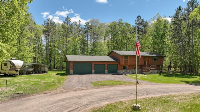 3015 Aspen Ter, Scott Twp, WI 54830 - bi-level home featuring driveway, an attached garage, a front lawn, and stone siding