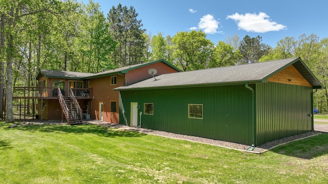 3015 Aspen Ter, Scott Twp, WI 54830 - rear view of property with stairway, a wooden deck, and a lawn