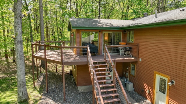 3015 Aspen Ter, Scott Twp, WI 54830 - back of property featuring stairs, a wooden deck, and a shingled roof