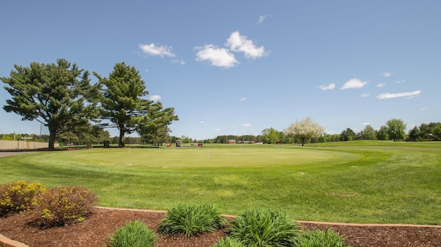 3015 Aspen Ter, Scott Twp, WI 54830 - view of community featuring a putting area, view of golf course, and a lawn