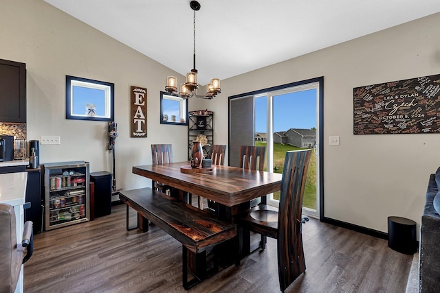 419 Bluebird Dr NW, Isanti, MN 55040 - dining area featuring lofted ceiling, dark wood finished floors, a chandelier, wine cooler, and baseboards