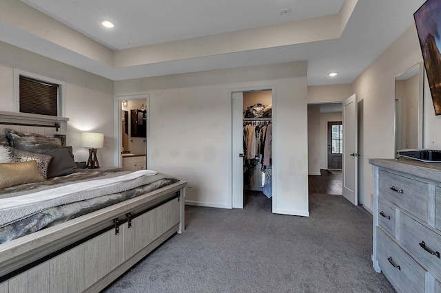 419 Bluebird Dr NW, Isanti, MN 55040 - bedroom featuring light colored carpet, baseboards, recessed lighting, ensuite bath, and a closet