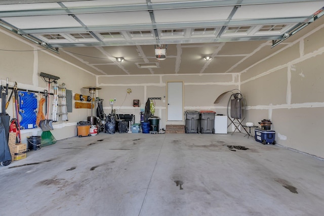 419 Bluebird Dr NW, Isanti, MN 55040 - garage featuring a garage door opener