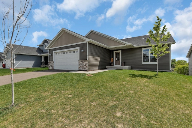 419 Bluebird Dr NW, Isanti, MN 55040 - view of front of property with driveway, a garage, a front yard, and stone siding
