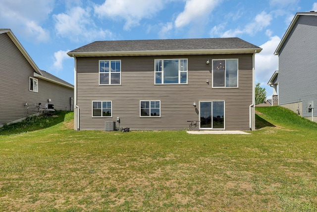 419 Bluebird Dr NW, Isanti, MN 55040 - rear view of property with a yard and central AC