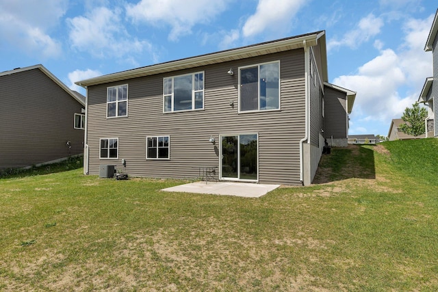 419 Bluebird Dr NW, Isanti, MN 55040 - rear view of property featuring a yard, a patio, and central AC