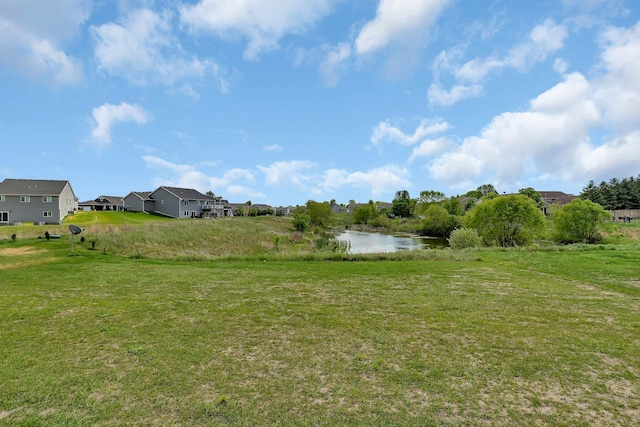 419 Bluebird Dr NW, Isanti, MN 55040 - view of green lawn featuring a water view