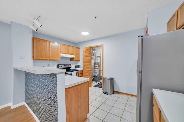 2225 Ranchview Ln N Unit 1, Plymouth, MN 55447 - kitchen with appliances with stainless steel finishes, under cabinet range hood, baseboards, and a peninsula